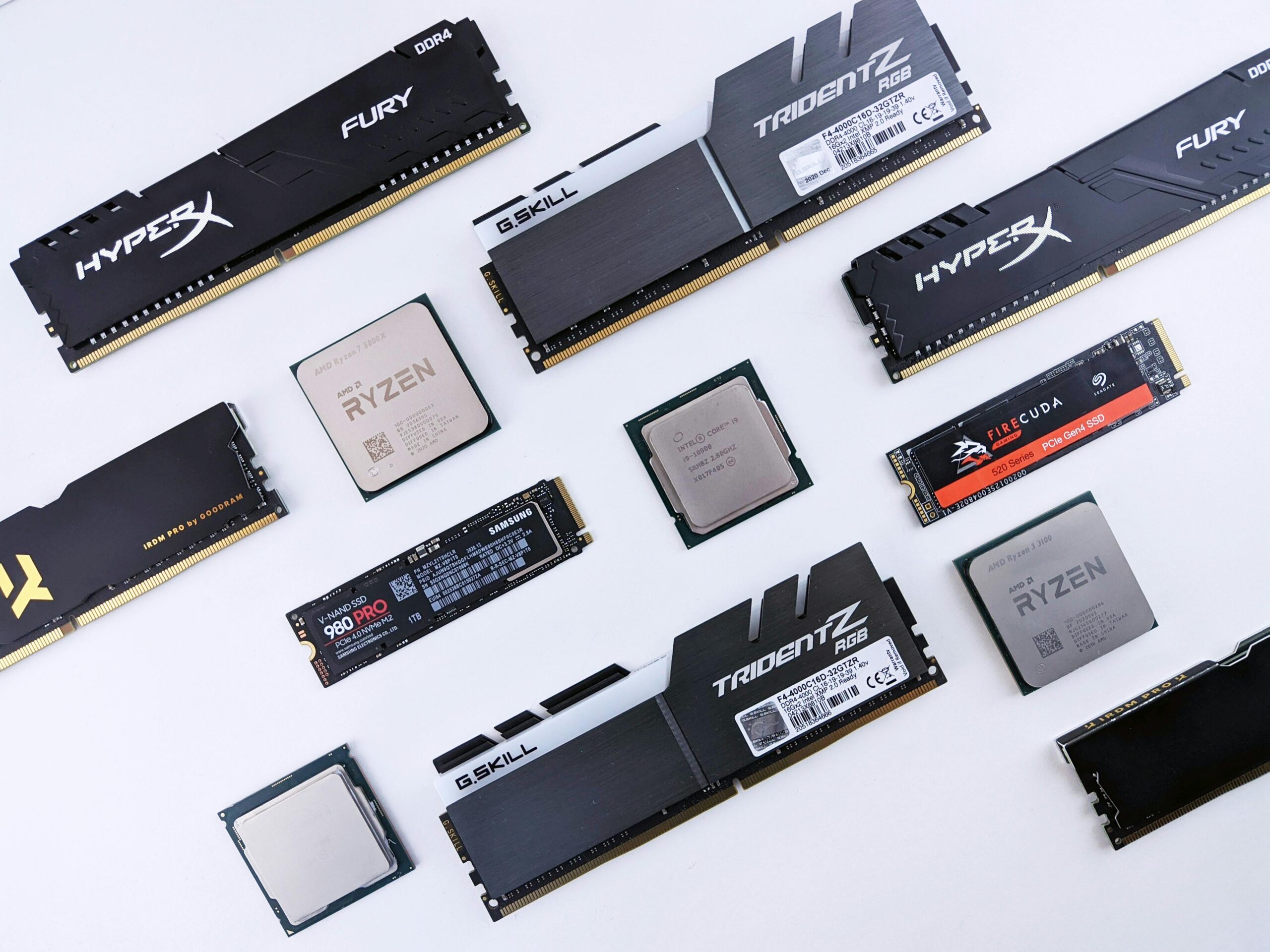 High-quality image of various computer components, including RAM and CPUs, on a white background.